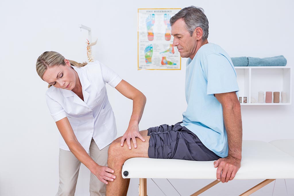 A doctor helping when knee pain is restricting mobility - Midland Knee Protect Clinic